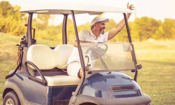 istock Senior man driving golf car. I am here. 1325530322
