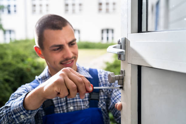 istock Locksmith Lock Door Repair. Worker Changing 1325531113