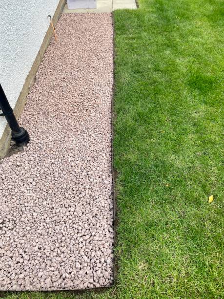 istock Red stone garden path at back of house 1325531239