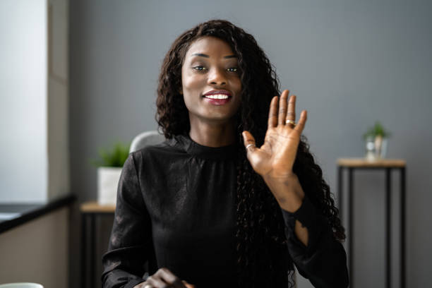 istock Woman Portrait Waving Hello 1325531286