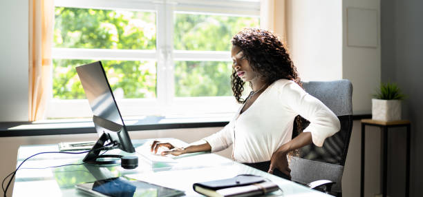 istock African Businesswoman Having Back Pain While Sitting 1325531324