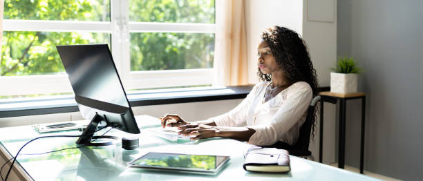 istock African American Black Woman Using Computer. Handicapped Worker 1325531337
