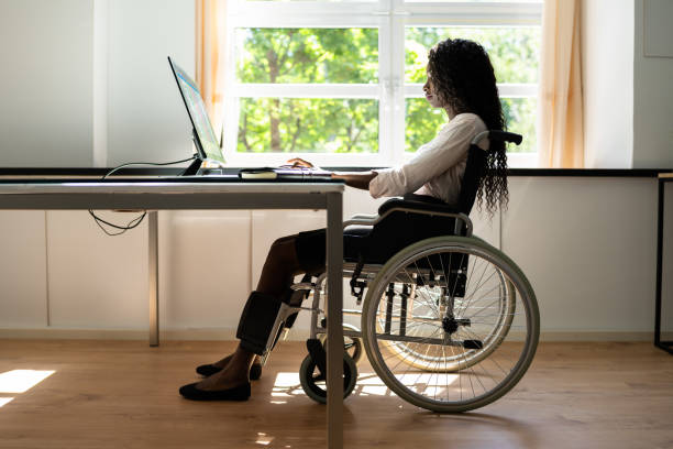 istock African American Black Woman Using Computer. Handicapped Worker 1325531365