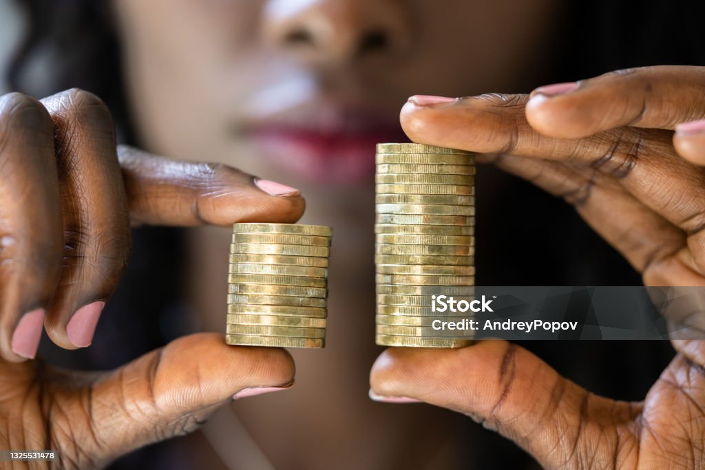 Compare Wage Gap And Tax Differences Compare Wage Gap And Tax Differences. Equal Pay Wages Stock Photo