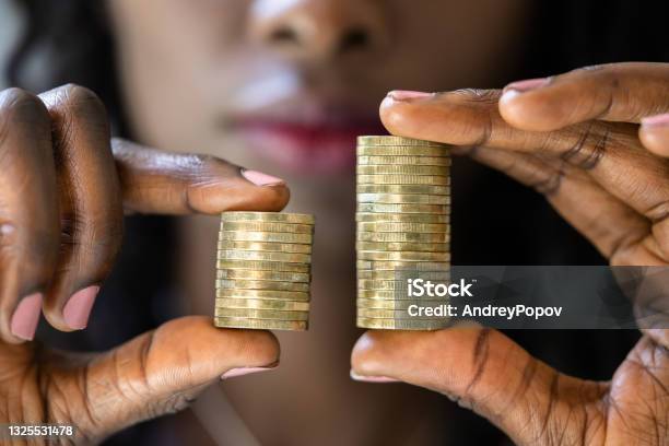 Compare Wage Gap And Tax Differences Stock Photo - Download Image Now - Wages, Equality, Imbalance