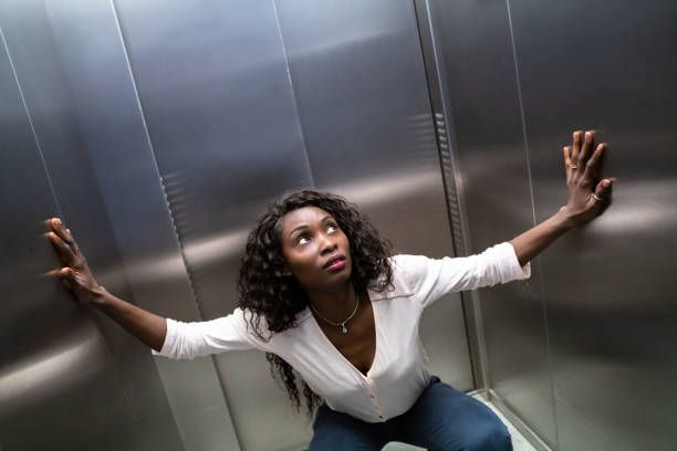 trapped or stuck inside elevator - claustrophobic imagens e fotografias de stock