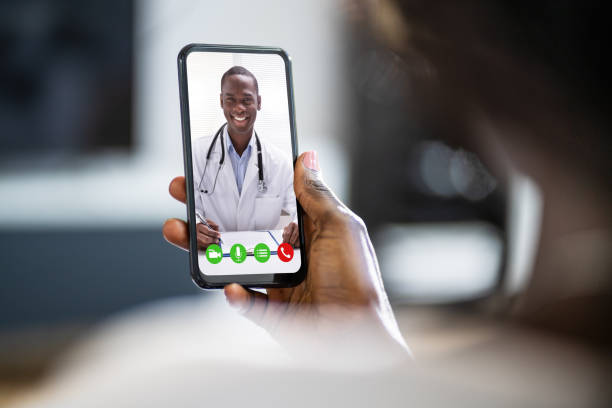 istock African Woman Doing Video Conference With Doctor 1325532695