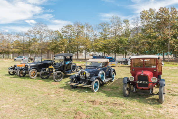 Vintage cars on display in Villiers Villiersdorp, South Africa - April 12, 2021: Vintage cars on display. Left to right,: Morris Minor, 1926 Model T, 1915 Model T, 1931 Model A roadster, Chevrolet 1927 pickup model t ford stock pictures, royalty-free photos & images