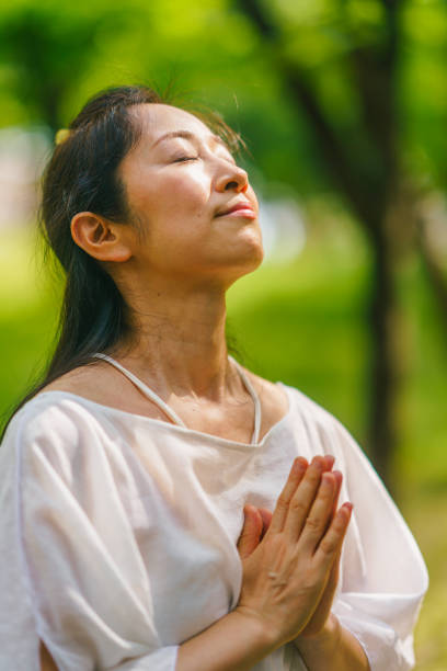 istock Woman practicing meditation and yoga in nature 1325537266