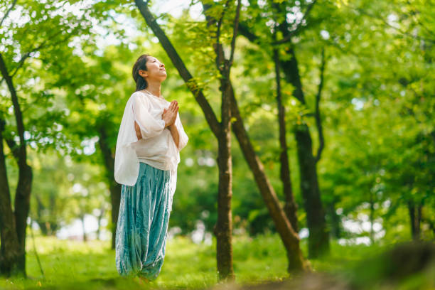 istock Woman practicing meditation and yoga in nature 1325537364