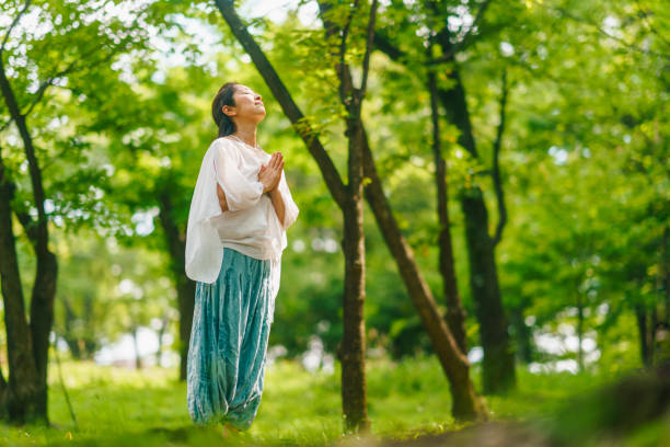 istock Woman practicing meditation and yoga in nature 1325537400