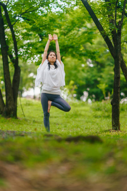 istock Woman practicing meditation and yoga in nature 1325537607