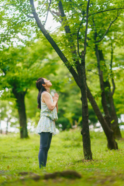 istock Woman practicing meditation and yoga in nature 1325537637