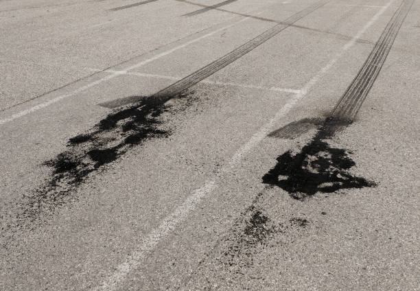 Tire abrasion on asphalt after a illegal car racing Tire abrasion on asphalt after a illegal car racing street racing stock pictures, royalty-free photos & images