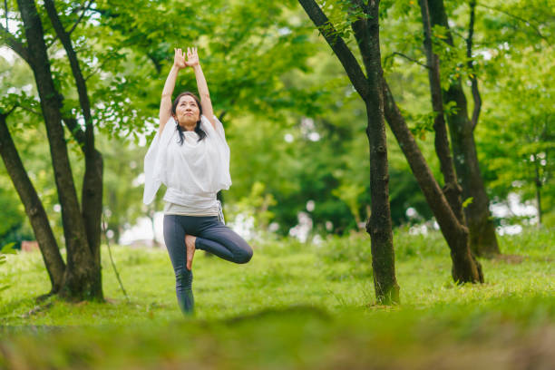 istock Woman practicing meditation and yoga in nature 1325538655