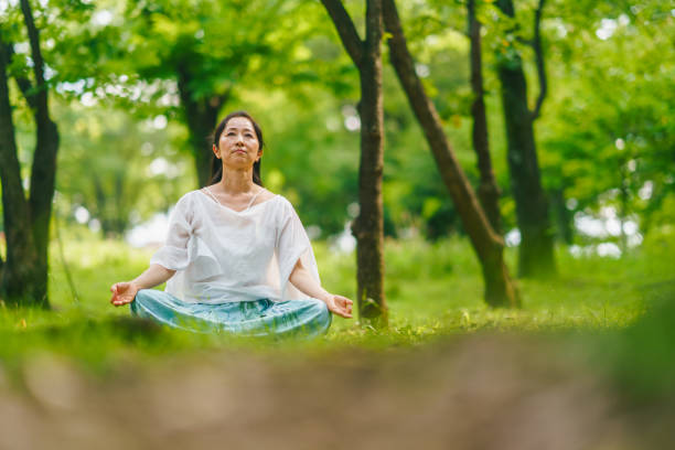 istock Woman practicing meditation and yoga in nature 1325539282