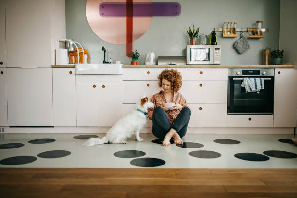 istock Beautiful redhead eating breakfast on the kitchen floor 1325539671