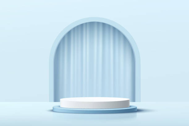 istock Modern white, blue cylinder pedestal podium with arch shape backdrop and blue curtains. Abstract pastel blue color minimal wall scene. Vector rendering 3d shape, cosmetic product display presentation. 1325541398
