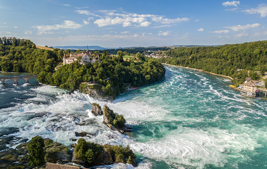 Dachsen, Switzerland - July 14.2020: Aerial photography with drone of Rhine Falls with Schloss Laufen castle, Switzerland. Rhine Falls is the largest waterfalls in Europe