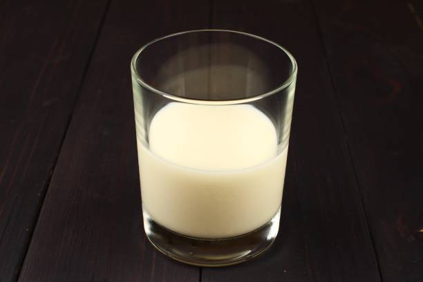 istock glass of milk on a dark background 1325547606