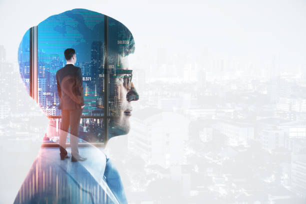 istock Thinking young businessman standing on abstract white city background with forex chart and mockup place. Brainstorming and market concept. Double exposure. 1325548921