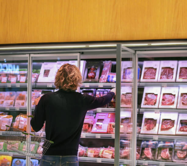 istock man choosing a dairy products at supermarket 1325549692