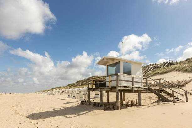 istock a lifeguard station and empty  beach chairs 1325551020