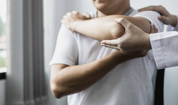 istock A professional physiotherapist is doing stretching for a patient, the patient has muscle dysfunction due to hard work, most often an office worker who has problems sitting for long periods of time. 1325553264