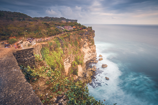 Sunset at cliff nature landscape tropical beach sea in Indonesia, Bali.