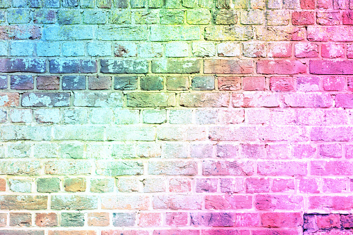 A brick wall in the colours of the rainbow. Concept of LGBT support.