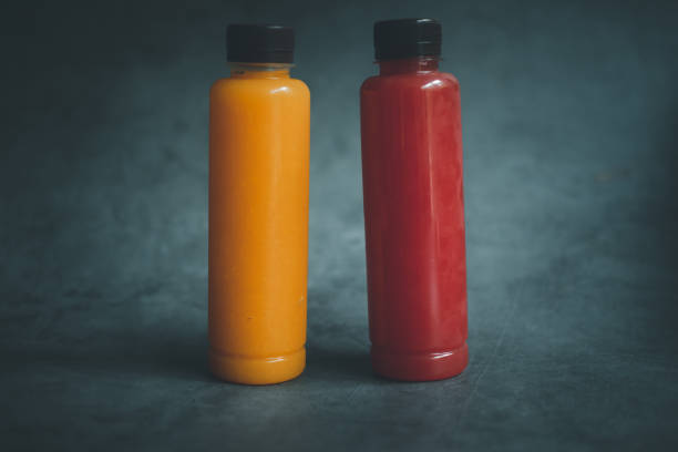 istock Watermelon and orange juice packed in plastic bottles. Freshly squeezed fruit 1325555064