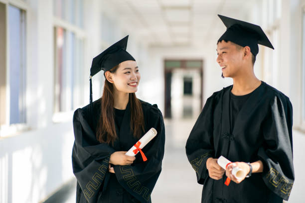 istock College graduates walking with friends and talk about their future 1325555813