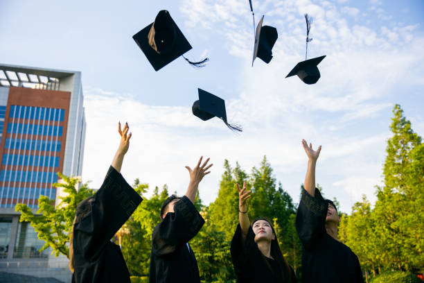 istock College students celebrating their graduation 1325555932