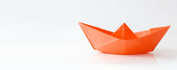 istock Red paper boat isolated on white background, banner with copy space 1325557337