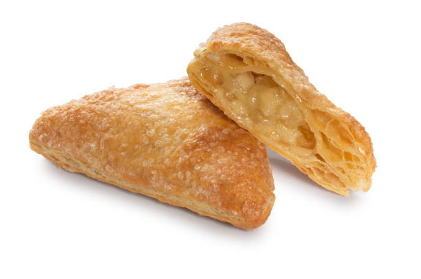 Apple Turnover on White Studio shot of Apple Turnover cut out against a white background. apple strudel stock pictures, royalty-free photos & images