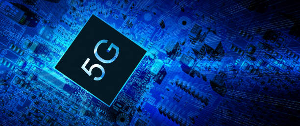 istock 5g concept. Digital computer motherboard with 5g mobile phone chip on wireless network business technology background. LTE data connection, global business, blockchain concept. 1325561200