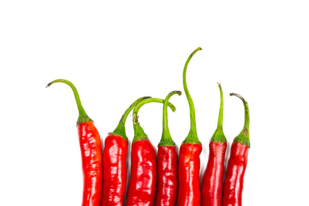 istock Red chili peppers on white background 1325562079