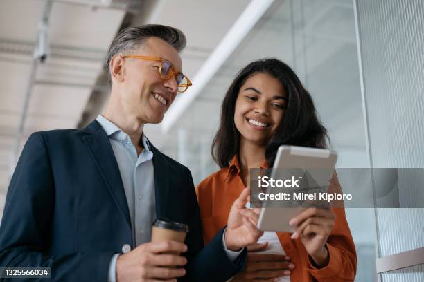 Business People Using Digital Tablet Planning Start Up Project Sharing Ideas At Workplace Successful Colleagues Working In Modern Office Business Meeting Concept Stock Photo - Download Image Now