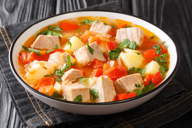 Bonito Marmitako Basque tuna stew with vegetables closeup in the plate. Horizontal Bonito Marmitako Basque tuna stew with vegetables closeup in the plate on the table. Horizontal boiled photos stock pictures, royalty-free photos & images