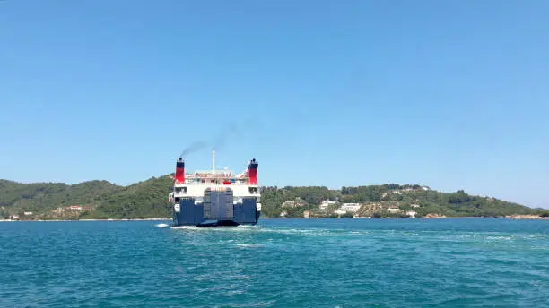 SKIATHOS, GREECE - JULY 2020: Express Skiathos Ferry boat from Hellenic Seaways Ferry company departs from the port of Skiathos island, Sporades, Greece.