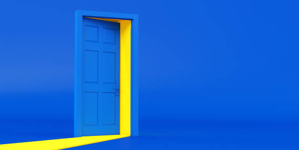 istock 3d render of yellow light going through the open door isolated on blue background. 1325568988