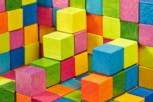 Simple structure built from colorful wooden cubes.