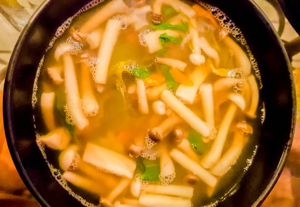 mushroom soup typical spicy thai food in restaurant bangkok thailand. - huai khwang district imagens e fotografias de stock