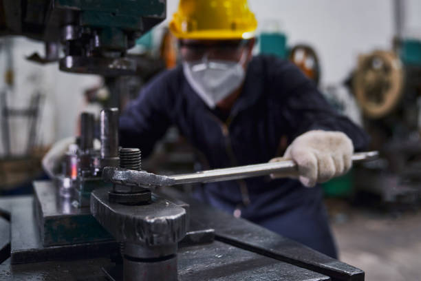 istock Engineer repair heavy machine with big wrench and focus on wrenc 1325572270