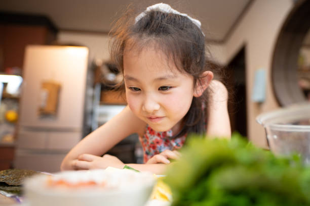 istock Girl looking forward to a meal 1325573648