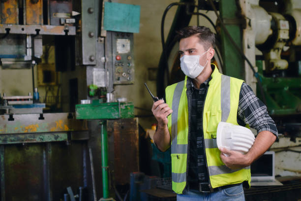 istock Engineer ware the mask and communicate with team in manufacturer 1325577485