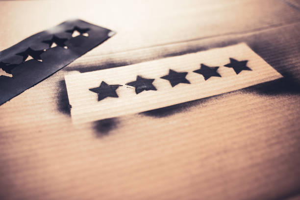 istock 5 star rating spray painted on a card 1325578376