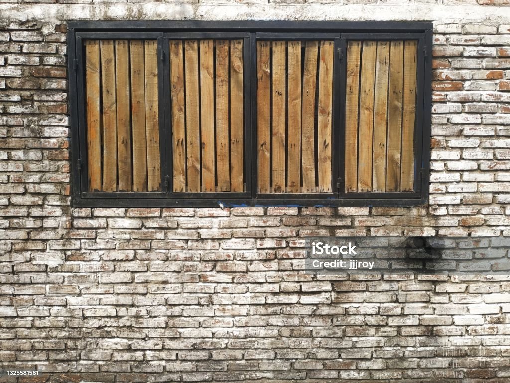Brown Wooden Shutters In Black Window Frame In A Dirty White Painted Brick  Wall Stock Photo - Download Image Now - Istock