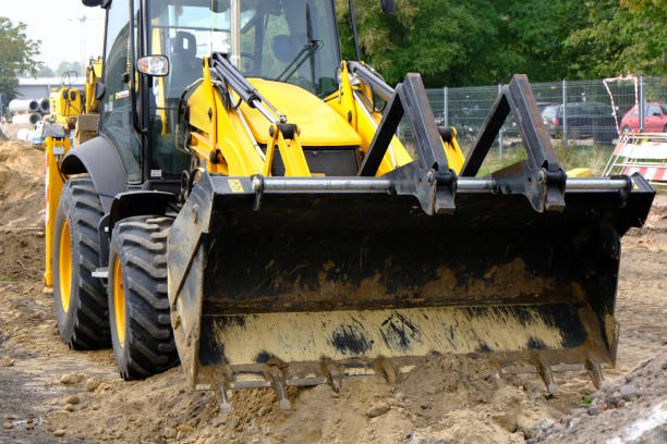 istock Front loader on a road construction on city street. 1325583593