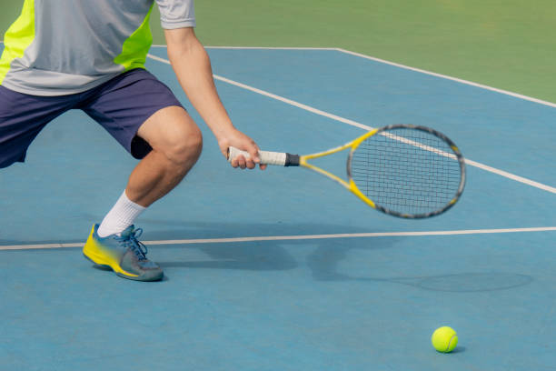 istock tennis ball detail on racket 1325588925